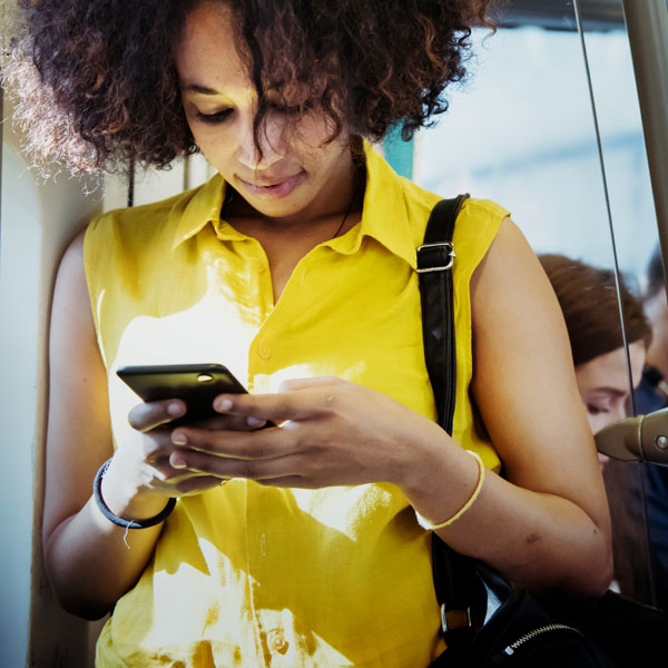 Woman reading digital learning programme on mobile phone